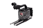 Load image into Gallery viewer, Wooden Camera Sony FX6 Unified Accessory Kit (Pro, V-Mount) fully assembled on a Sony FX6 camera, showing the top plate, baseplate, 15mm rods, and V-mount battery plate.