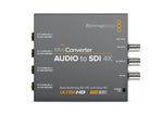 Load image into Gallery viewer, Front and back view of the Blackmagic Design Mini Converter - Audio to SDI 4K, showing audio and SDI connections.