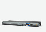 Load image into Gallery viewer, Front view of the Blackmagic Smart Videohub CleanSwitch 12x12, showing the LCD screen, control buttons, and spin knob.