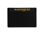 Load image into Gallery viewer, Portrait Displays G1 4K HDR video pattern generator, a compact black device with HDMI and USB-C ports, shown from a three-quarter angle.