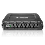 Load image into Gallery viewer, Glyph Technologies Blackbox Plus portable solid-state drive with its black ruggedized housing, shown with included USB-C and USB-A cables.