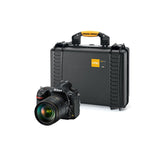 Load image into Gallery viewer, HPRC 2460 hard case in black, open to show the custom foam interior with cutouts for a Nikon D850 camera, lenses, and accessories.