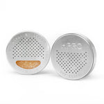 Load image into Gallery viewer, The HPRC Dry Keeper, a compact black container filled with orange indicating silica gel beads designed to absorb moisture inside protective cases.