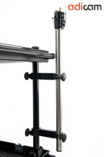 Load image into Gallery viewer, Pair of black adicam Crossbar Clamps securely mounted to the side of a professional camera cart, holding a silver 35mm pipe in place.