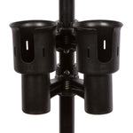 Load image into Gallery viewer, The black RoboCup dual drink holder clamped securely to the arm of a white patio chair, holding two beverage cans.
