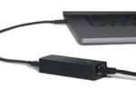 Load image into Gallery viewer, Sonnet Thunderbolt AVB Adapter shown from an angle, displaying its compact black chassis with the Thunderbolt port and RJ45 Ethernet port visible.