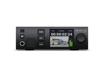 Load image into Gallery viewer, Front view of the Blackmagic Design 2110 IP SDI to HDMI 12G converter, showing the front panel LCD screen, headphone jack, and controls.
